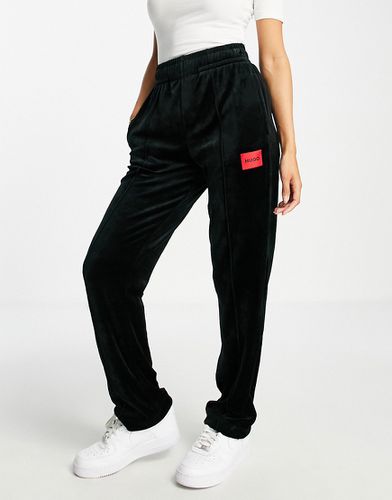 HUGO - Pantaloni casual a fondo ampio in velluto neri con logo in coordinato-Nero - HUGO Bodywear - Modalova