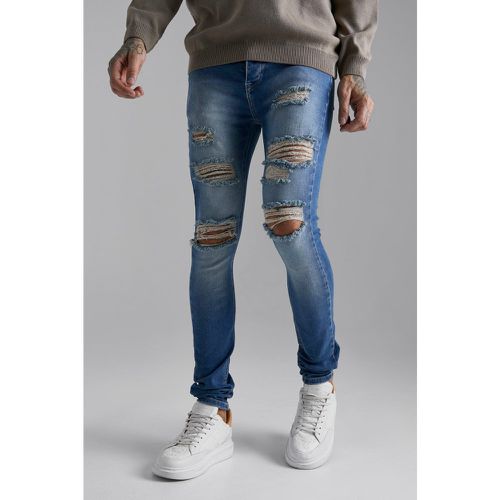 Jeans Super Skinny Fit Stretch strappati con pieghe sul fondo - boohoo - Modalova